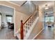Welcoming entryway with a staircase and hardwood floors leading to the living areas at 1900 Shady Creek Ln, Lawrenceville, GA 30043