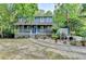Charming two-story home featuring a welcoming front porch and beautiful landscaping at 1900 Shady Creek Ln, Lawrenceville, GA 30043