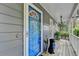 Close-up of a bright blue front door and charming front porch details at 1900 Shady Creek Ln, Lawrenceville, GA 30043