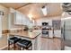 Bright kitchen features white cabinets, wood ceiling, stainless steel appliances, and butcher block countertops at 1900 Shady Creek Ln, Lawrenceville, GA 30043