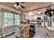 Bright kitchen features white cabinets, wood ceiling, stainless steel appliances, island and breakfast nook at 1900 Shady Creek Ln, Lawrenceville, GA 30043