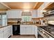 Kitchen features white cabinets, butcher block countertops, and stainless steel appliances at 1900 Shady Creek Ln, Lawrenceville, GA 30043