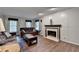 Comfortable living room featuring a fireplace and plenty of seating at 1900 Shady Creek Ln, Lawrenceville, GA 30043