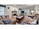 Spacious living room with a fireplace, comfortable seating, and hardwood floors at 1900 Shady Creek Ln, Lawrenceville, GA 30043