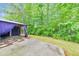 Backyard oasis with a gazebo and lush trees, perfect for outdoor living and relaxation at 2534 Grayton Loop, Villa Rica, GA 30180