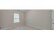 Neutral bedroom featuring plush carpet, a window, and a closet door, creating a serene and comfortable space at 2534 Grayton Loop, Villa Rica, GA 30180