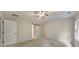 Carpeted bedroom with two doors, a ceiling fan and natural light at 2534 Grayton Loop, Villa Rica, GA 30180