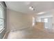 Large bonus room with neutral carpet, natural light, and hallway access at 2534 Grayton Loop, Villa Rica, GA 30180