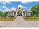 Attractive community clubhouse with a paved walkway and vibrant floral landscaping, enhancing neighborhood aesthetics at 2534 Grayton Loop, Villa Rica, GA 30180
