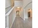 Inviting hallway features gray vinyl flooring and archways that lead to other rooms in the home at 2534 Grayton Loop, Villa Rica, GA 30180