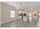 Bright kitchen featuring stainless steel appliances, stone countertops, and light wood flooring at 2534 Grayton Loop, Villa Rica, GA 30180