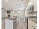 Eat-in kitchen featuring stainless appliances, a granite countertop island, and a view into the living room at 2534 Grayton Loop, Villa Rica, GA 30180