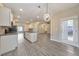 Open kitchen with an island, stainless steel appliances, and access to an open floorplan at 2534 Grayton Loop, Villa Rica, GA 30180