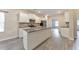 Spacious kitchen featuring white cabinetry, a granite countertop island, and stainless steel appliances at 2534 Grayton Loop, Villa Rica, GA 30180