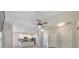 Open concept living room featuring a fireplace, kitchen, and a ceiling fan at 2534 Grayton Loop, Villa Rica, GA 30180