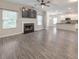 Bright and airy living room with a fireplace, lots of windows, and an open-concept kitchen at 2534 Grayton Loop, Villa Rica, GA 30180