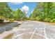 A paved play area features hopscotch and tic-tac-toe, offering engaging outdoor activities for children in the neighborhood at 2534 Grayton Loop, Villa Rica, GA 30180