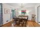 Traditional dining room with hardwood floors, chandelier, and seating for six at 4730 Geneva Sw Dr, Lilburn, GA 30047