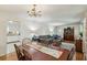 Open-concept dining room features hardwood floors and connects to the living room and kitchen at 4730 Geneva Sw Dr, Lilburn, GA 30047