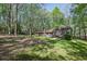 A lovely brick home with a spacious yard surrounded by mature trees, provides a peaceful setting at 4730 Geneva Sw Dr, Lilburn, GA 30047
