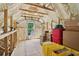 Partially finished attic with ample storage, spray foam insulation, and a small window for natural light at 4840 Moon Rd, Powder Springs, GA 30127