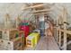 Unfinished attic space featuring spray foam insulation, wooden beams, and ample room for storage at 4840 Moon Rd, Powder Springs, GA 30127