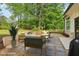 Comfortable backyard patio seating area with gravel landscaping, ideal for outdoor relaxation at 4840 Moon Rd, Powder Springs, GA 30127