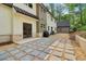 View of the home's exterior, backyard, patio, and a detached structure surrounded by lush trees at 4840 Moon Rd, Powder Springs, GA 30127