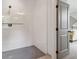 Contemporary bathroom with glass shower, gray tile floor, and doorway at 4840 Moon Rd, Powder Springs, GA 30127