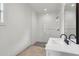 Modern bathroom featuring a glass-enclosed shower and sleek vanity with black faucet at 4840 Moon Rd, Powder Springs, GA 30127