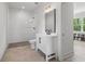 Bright bathroom featuring a glass shower, modern vanity with a white cabinet, and stylish finishes at 4840 Moon Rd, Powder Springs, GA 30127