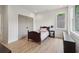 Bright bedroom featuring hardwood floors, a window, and closet at 4840 Moon Rd, Powder Springs, GA 30127