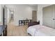 Bright bedroom with hardwood floors, a comfy bed, and bookcase; a perfect retreat for relaxation and reading at 4840 Moon Rd, Powder Springs, GA 30127