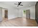 Spacious bedroom with a walk-in closet, light hardwood floors, and neutral paint at 4840 Moon Rd, Powder Springs, GA 30127