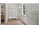 A well-organized walk-in closet with custom shelving, hanging rods, and a window for natural light at 4840 Moon Rd, Powder Springs, GA 30127
