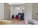 Spacious walk in closet with neutral colors and modern light fixture at 4840 Moon Rd, Powder Springs, GA 30127