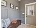 Welcoming entryway with wainscoting, bench seating, and stylish decor at 4840 Moon Rd, Powder Springs, GA 30127
