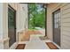 Exterior view showcasing meticulous landscaping, a connecting walkway, and architectural design at 4840 Moon Rd, Powder Springs, GA 30127