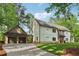 Beautiful two-story home with a large front yard, attached garage, and light colored facade at 4840 Moon Rd, Powder Springs, GA 30127