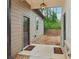 Home exterior with brown door, gravel walkway, outdoor lighting, and professionally landscaped yard at 4840 Moon Rd, Powder Springs, GA 30127