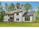Charming two-story home with a well-manicured lawn and modern design at 4840 Moon Rd, Powder Springs, GA 30127