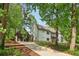 Spacious house surrounded by mature trees and a long concrete driveway at 4840 Moon Rd, Powder Springs, GA 30127