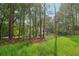 Idyllic home nestled among tall trees in a serene, wooded setting at 4840 Moon Rd, Powder Springs, GA 30127