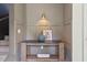 Close-up of a foyer featuring gray walls, decorative art, and a stylish console table at 4840 Moon Rd, Powder Springs, GA 30127