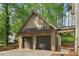 Detached garage with two-car entry, modern design, and covered walkway to main house at 4840 Moon Rd, Powder Springs, GA 30127