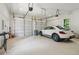 Two-car garage with updated lighting, modern fixtures, and room for parking and storage at 4840 Moon Rd, Powder Springs, GA 30127