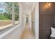Hallway with large picture window and decorative lighting fixtures at 4840 Moon Rd, Powder Springs, GA 30127