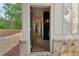 Hallway view showing neutral decor, light wood flooring, and modern wall sconces at 4840 Moon Rd, Powder Springs, GA 30127