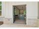 View of the kitchen from the outside with a central island and modern appliances at 4840 Moon Rd, Powder Springs, GA 30127
