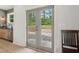 Kitchenette with stainless steel dishwasher and sink with stylish faucet next to French doors with patio view at 4840 Moon Rd, Powder Springs, GA 30127